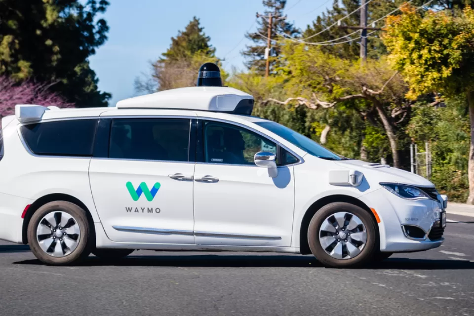 White Waymo autonomous minivan